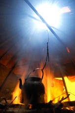 Coffee pot boiling in a traditional Sami tent (a Goahti or Kåta) on a reindeer sledding safari.